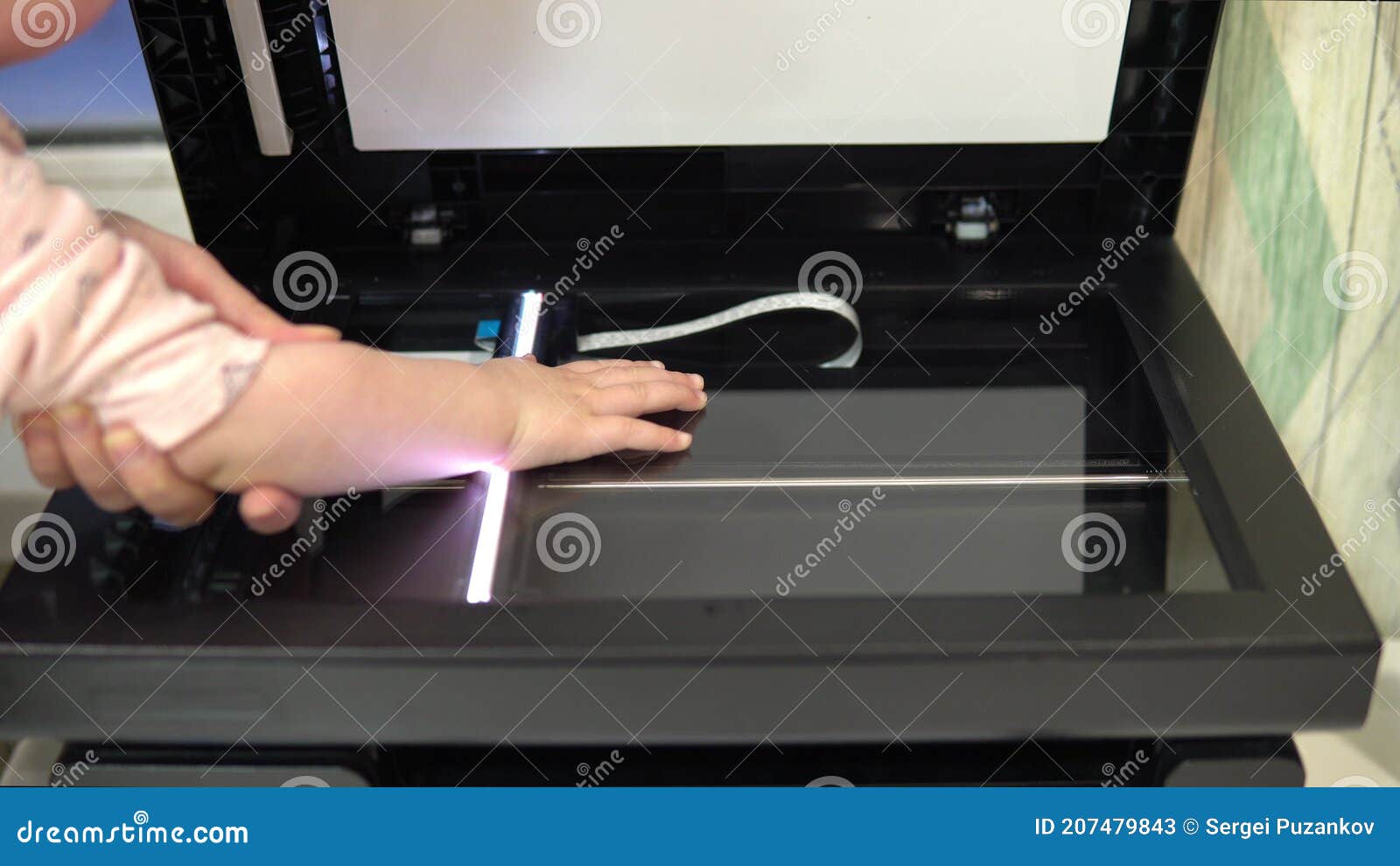 Hand Scanning Process. the Scanner in Operation Scans a Child& X27;s