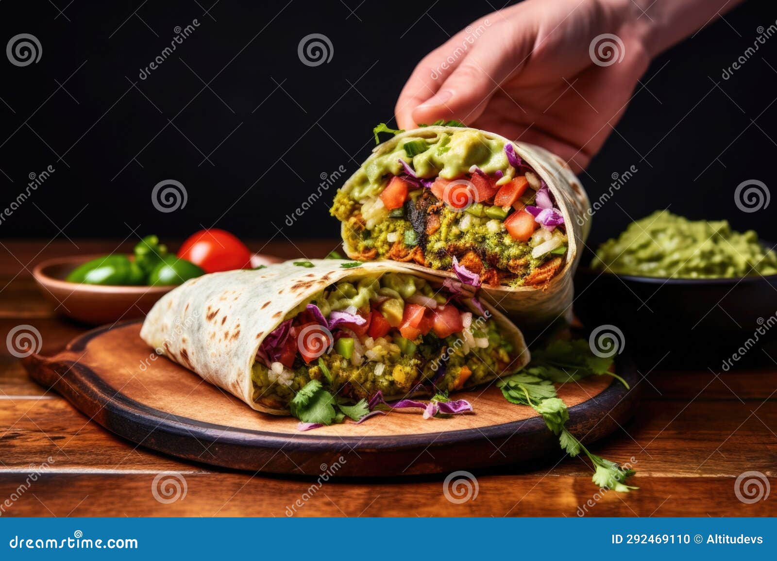 Hand Serving a Big Burrito with Extra Guacamole Stock Photo Image of