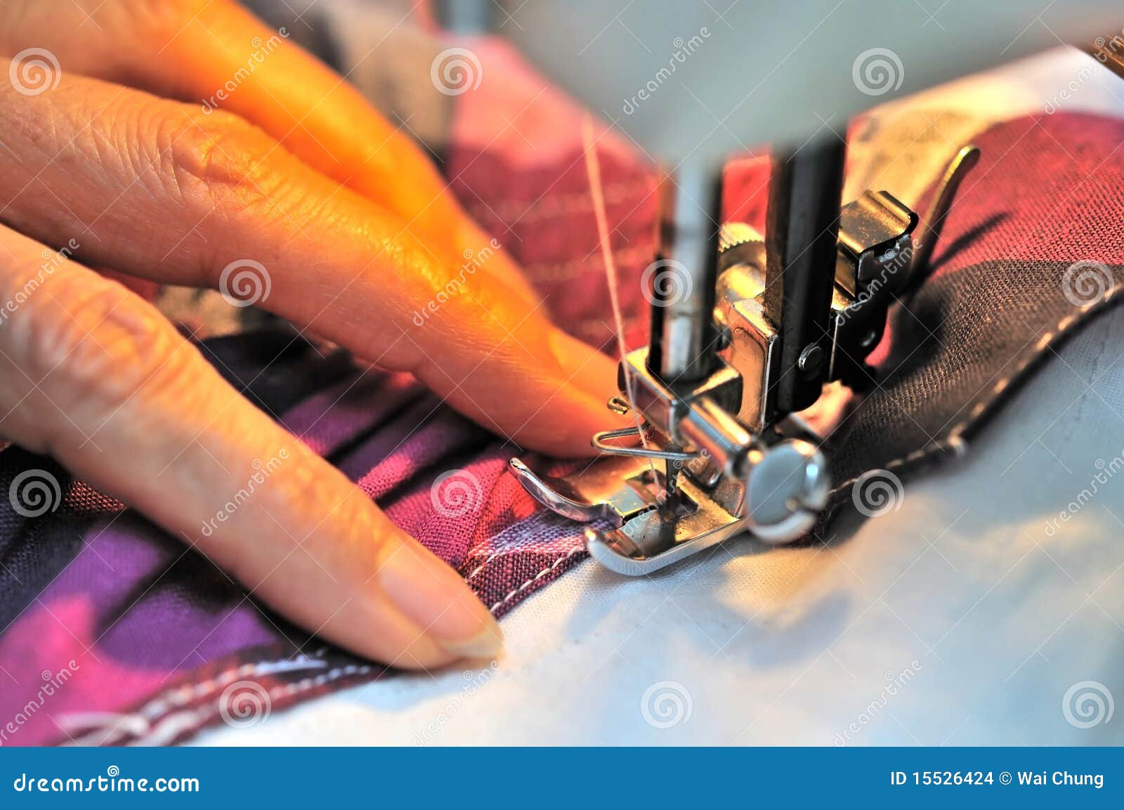 Hand at sewing machine stock photo. Image of industry 15526424