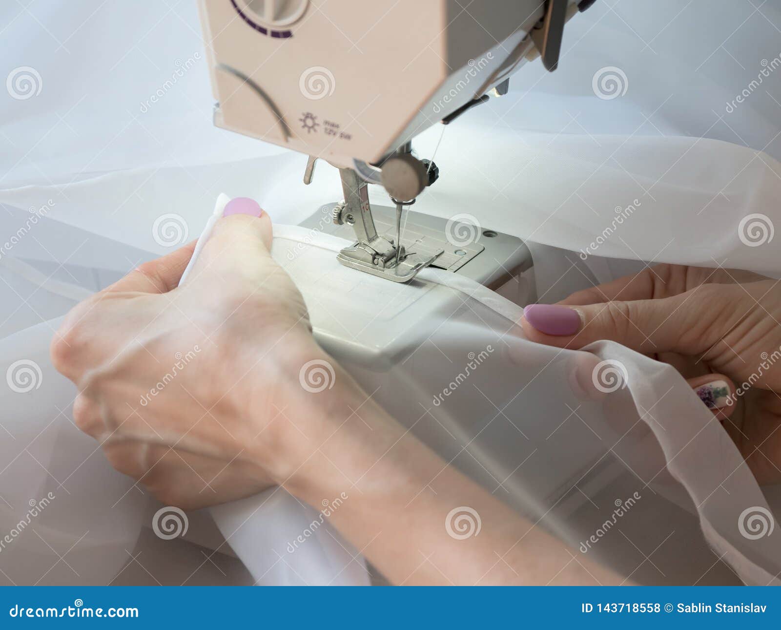 Hand Sews a Tulle on the Sewing Machine. Stock Photo Image of machine