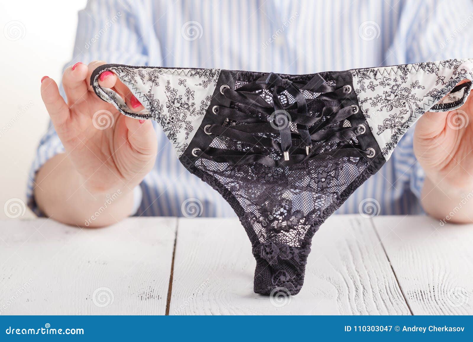 Hand of Young Woman Holding Lace Panties Stock Image - Image of