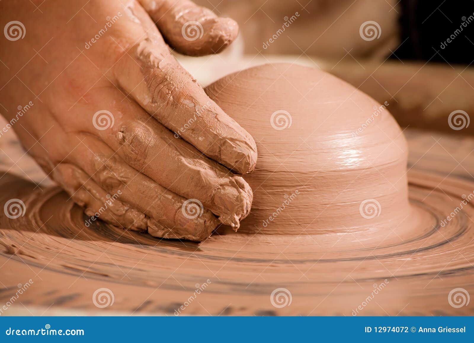 hand shaping wedge of clay