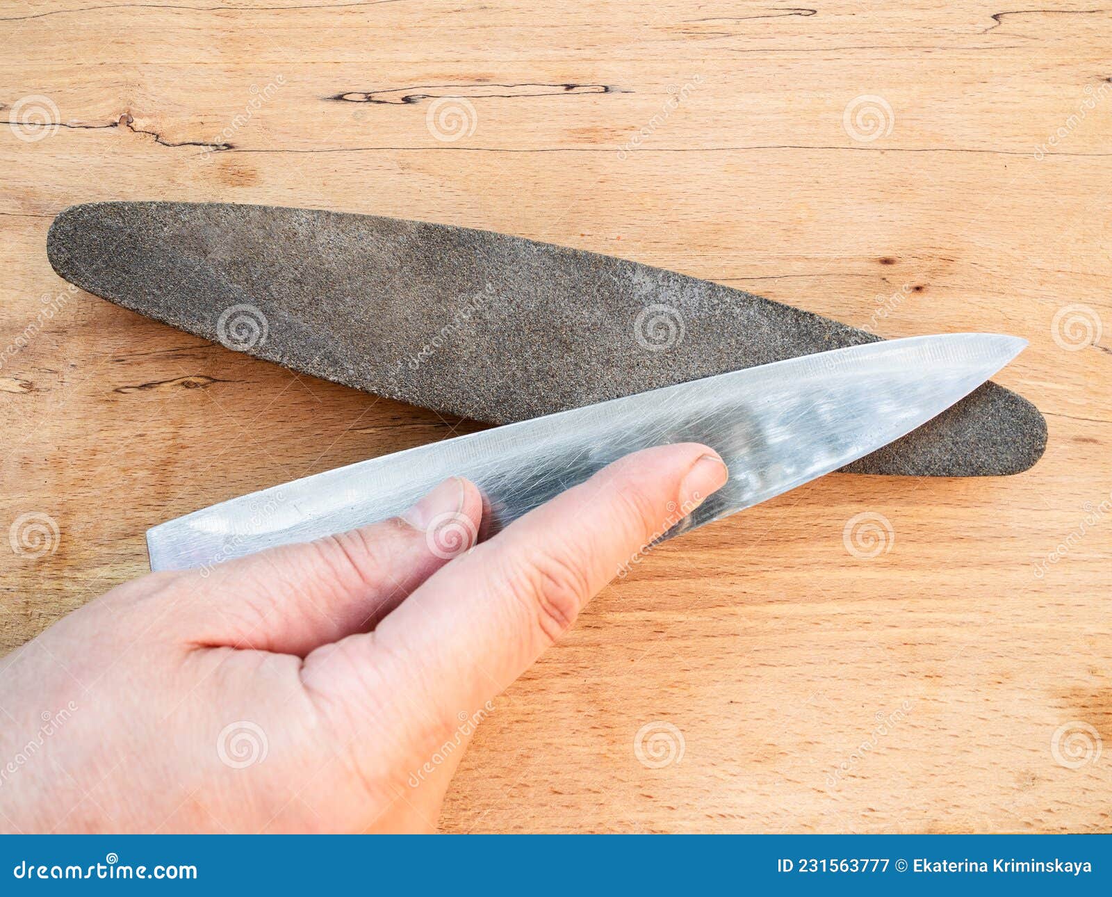 Hand Sharpens Kitchen Knife Closeup on Whetstone Stock Image Image of