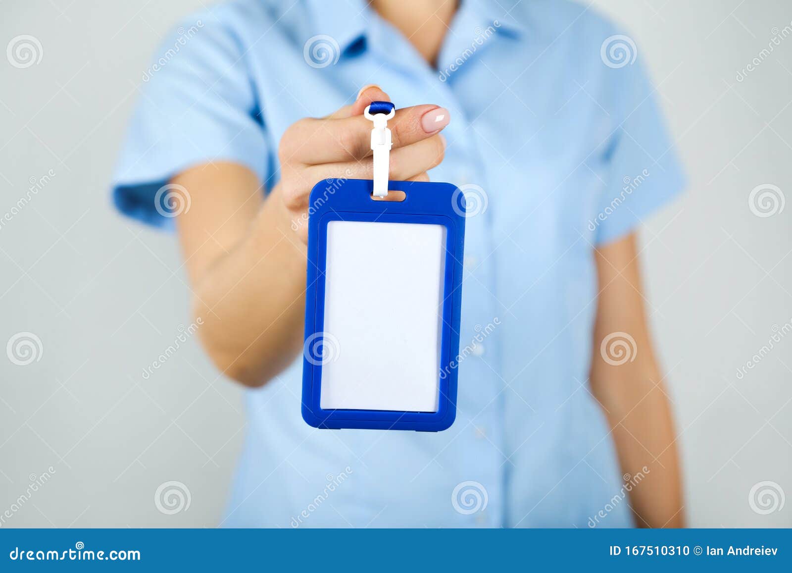 hand showing blank white bagde