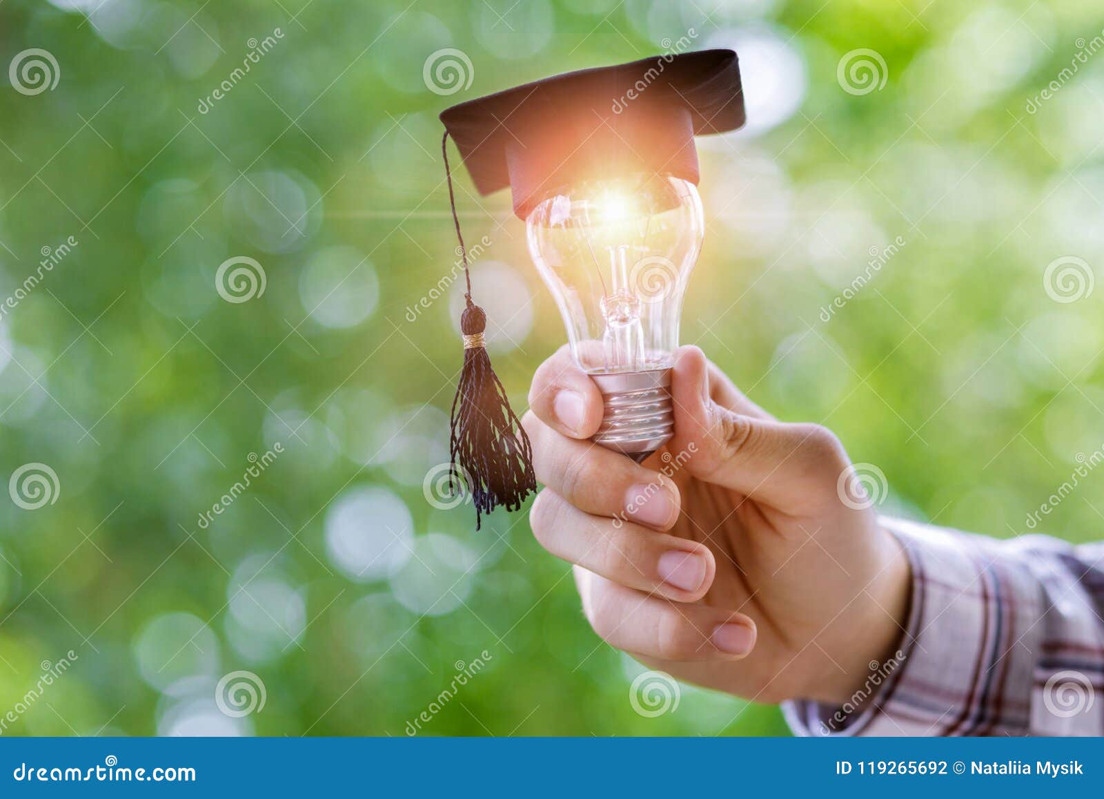 hand shows light bulb in the cap academic .