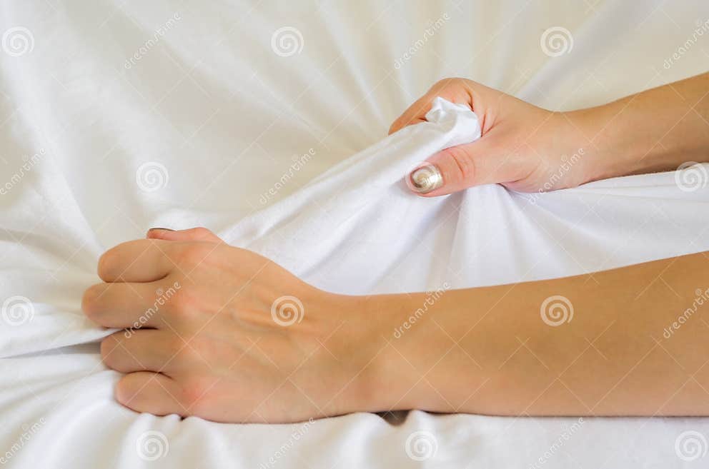 Hand Sign Orgasm Of Woman On White Bed Hand Of Female Pulling White Sheets In Ecstasy