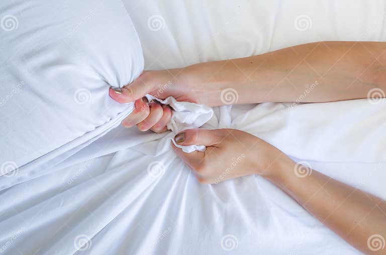 Hand Sign Orgasm Of Woman On White Bed Hand Of Female Pulling White Sheets In Ecstasy