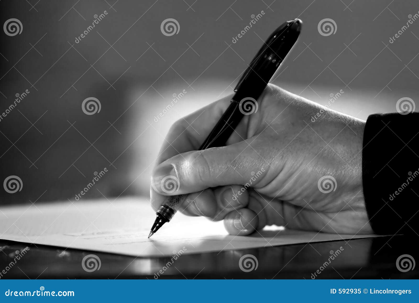 hand signing paperwork/contract (black & white)