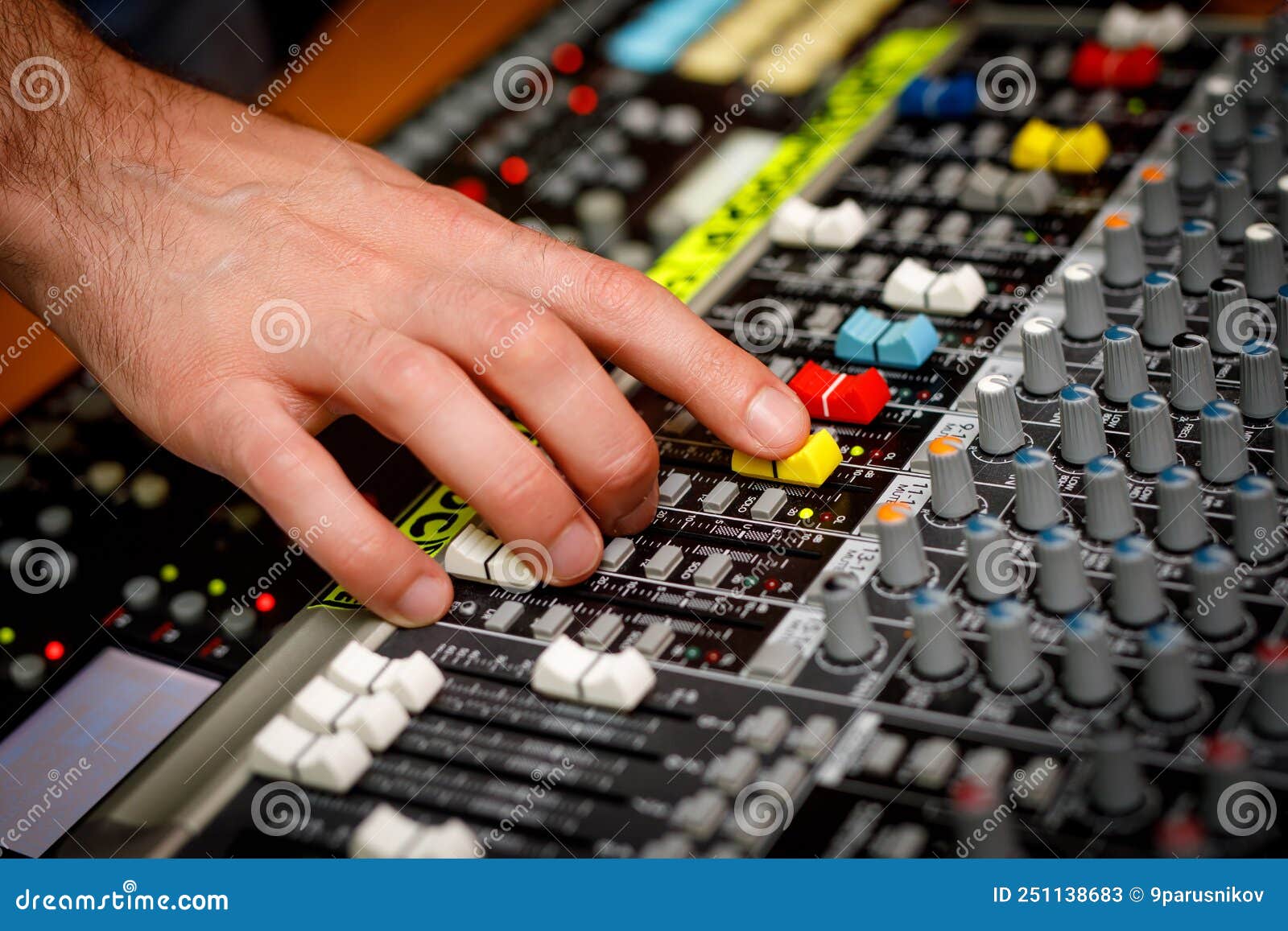 Hand of a Sound Manager on Sound Console Mixer. Equalizer Control ...