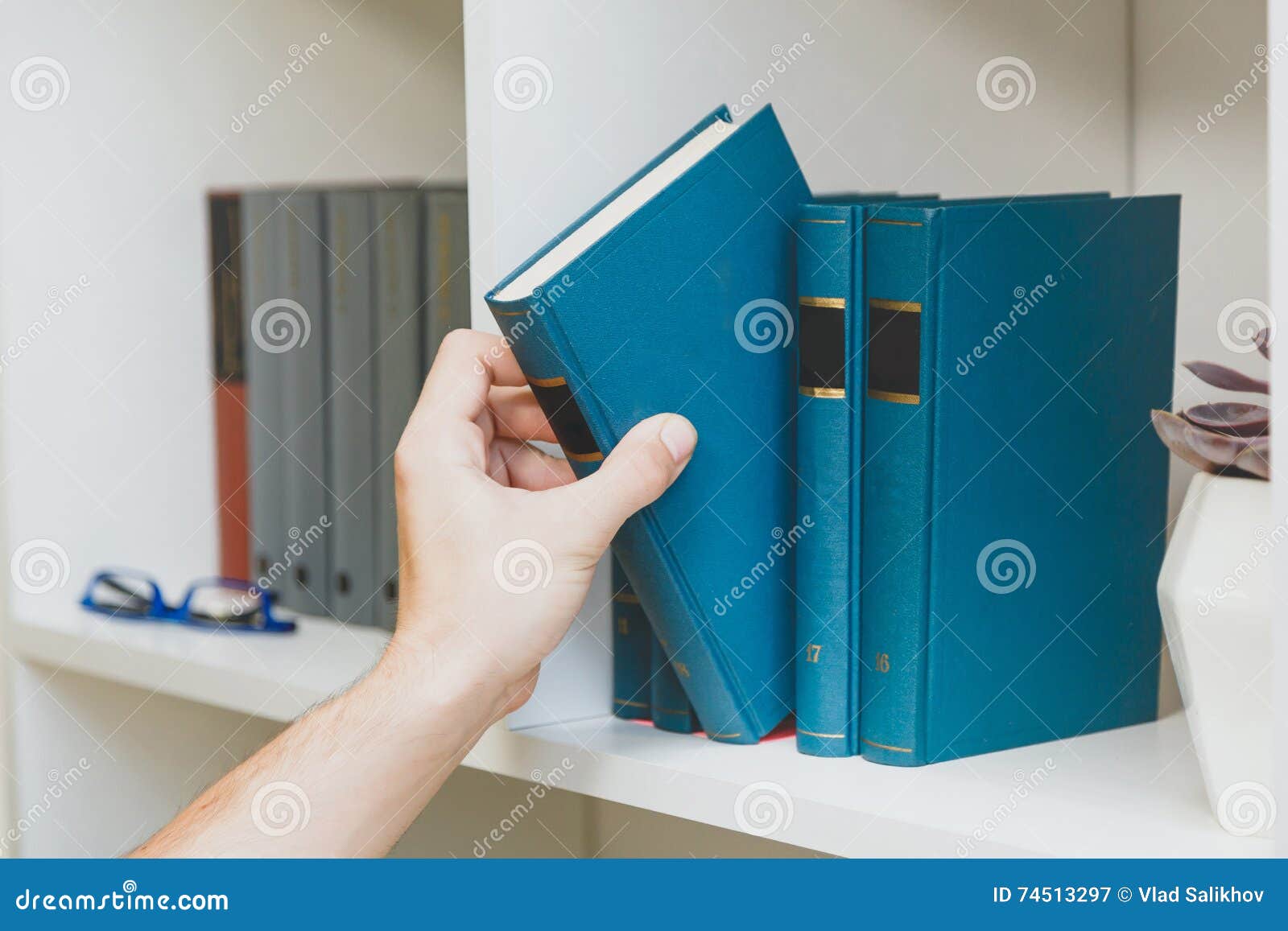 Hand Taking Book from the Shelf Stock Image Image of choosing, person 74513297