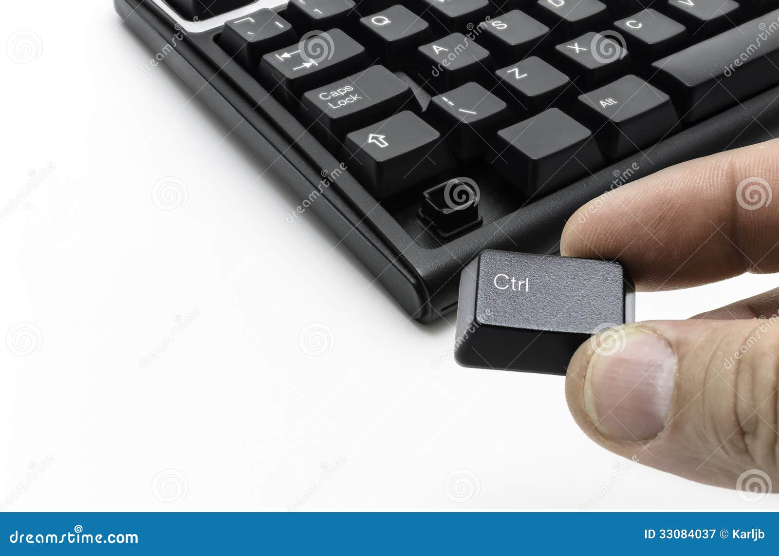 Hand taking control key from keyboard on white background stock image