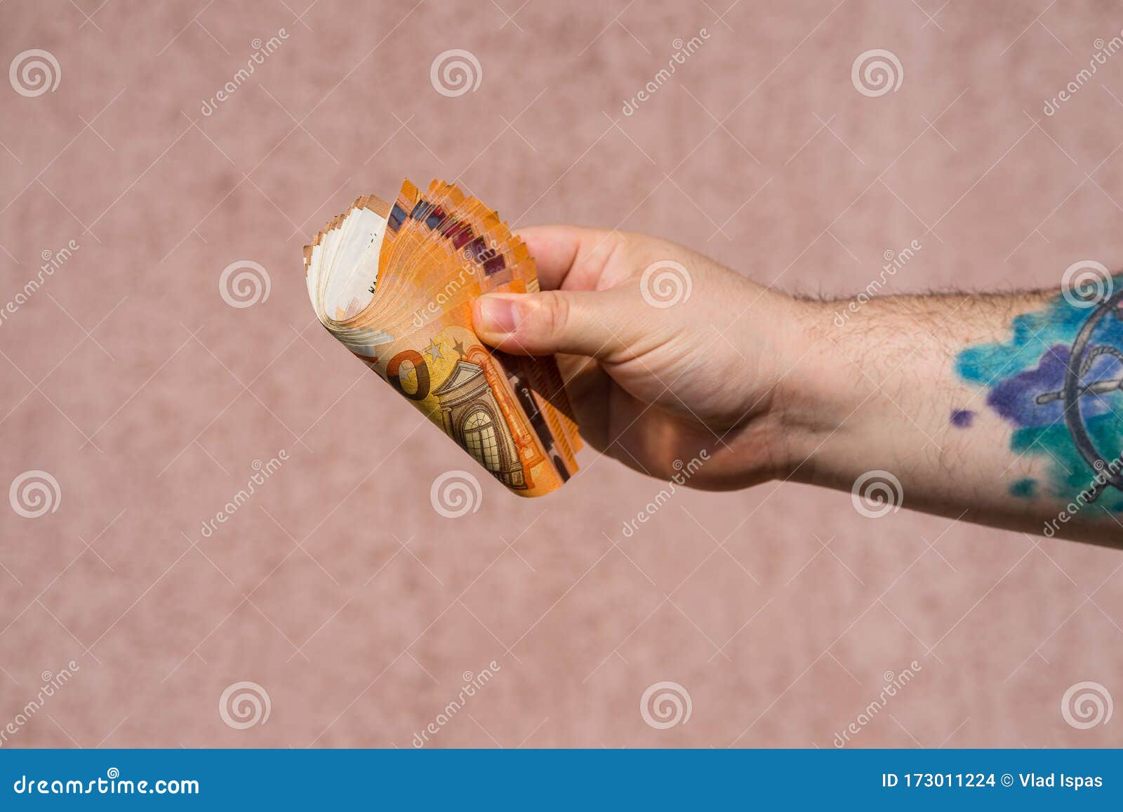 Hand with Tattoo Holding Showing Euro Money and Giving or Receiving Money  Like Tips, Salary. 50 EURO Banknotes EUR Currency Editorial Stock Image -  Image of closeup, concept: 173011224