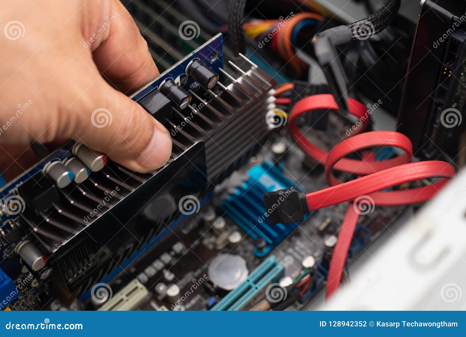 hand of technician installing a new graphics card gpu in pc ,