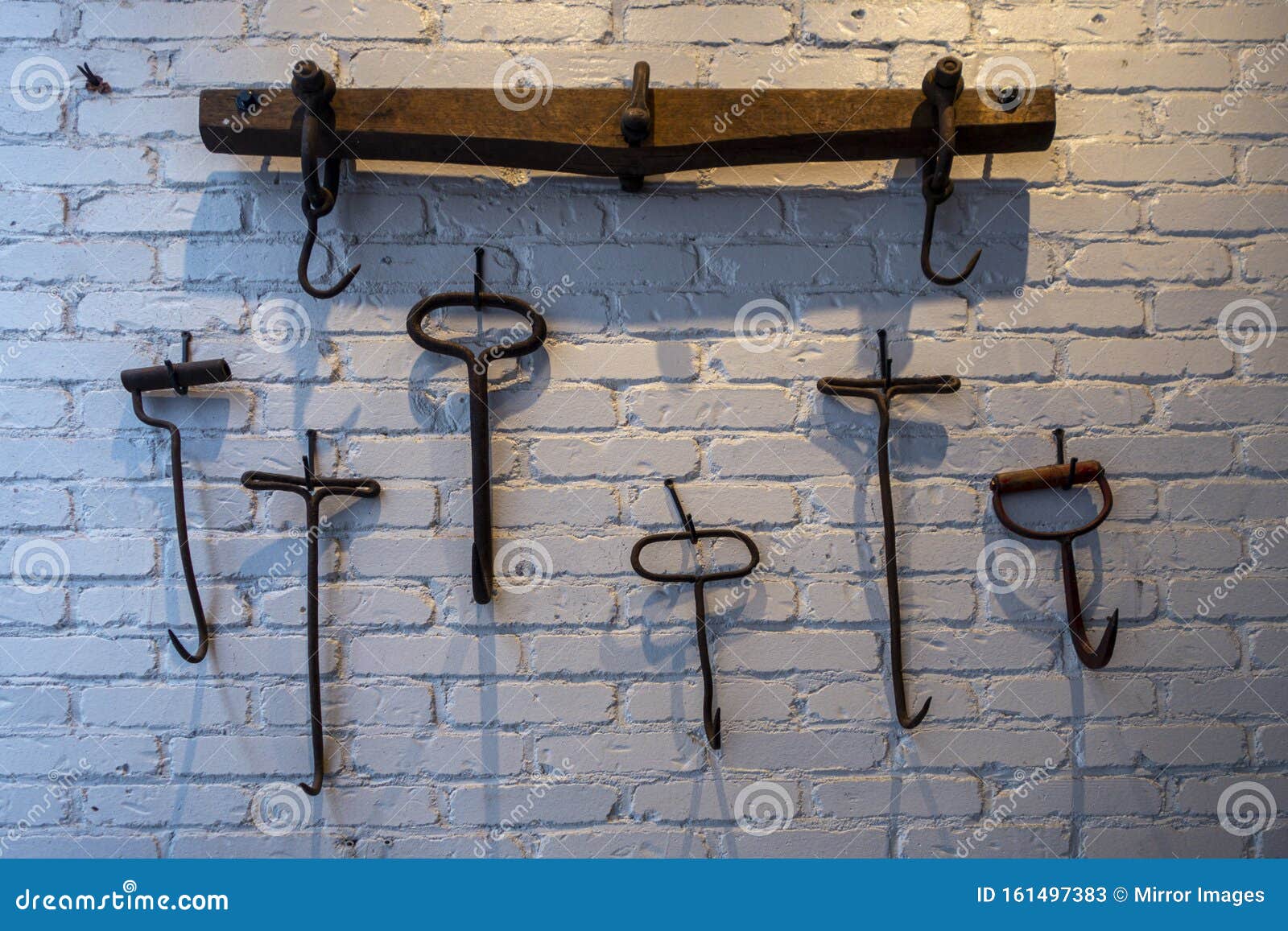 Hand Tool Fish Docking Hooks or Hay-bale Hooks on a White Brink Wall Stock  Image - Image of tools, decoration: 161497383