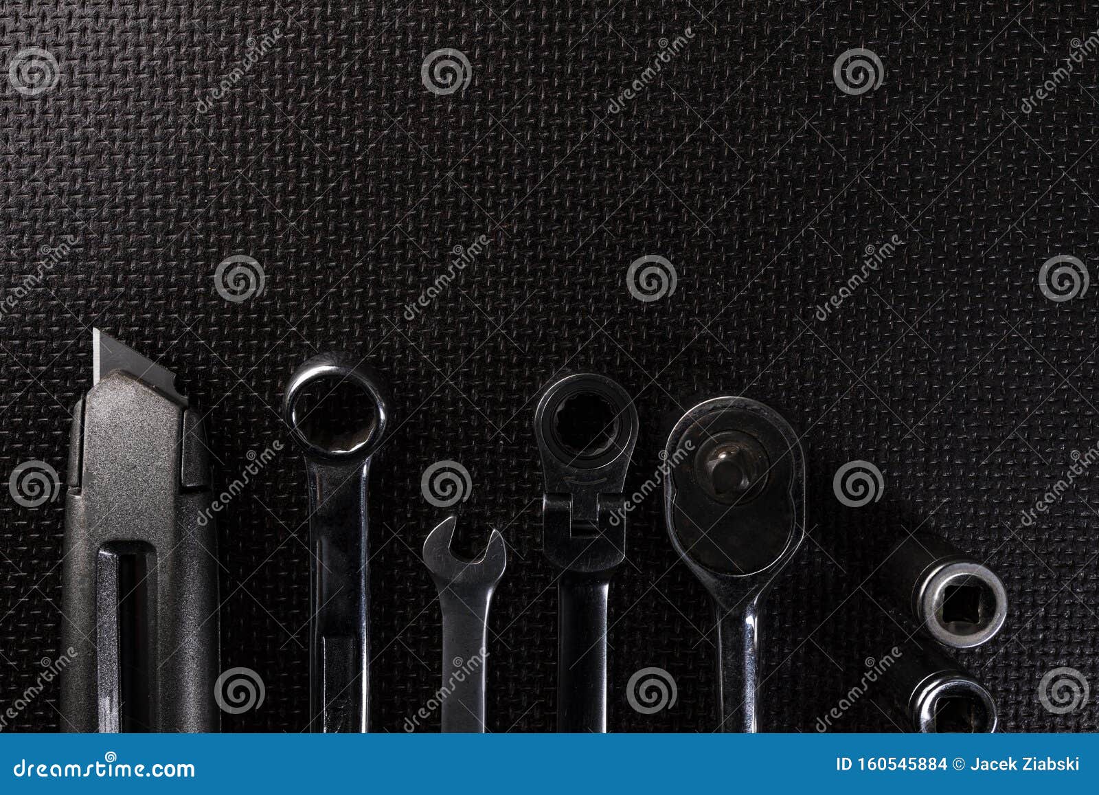 The Hand Tools Set. Utility Knife, Combination Wrenches and a Socket