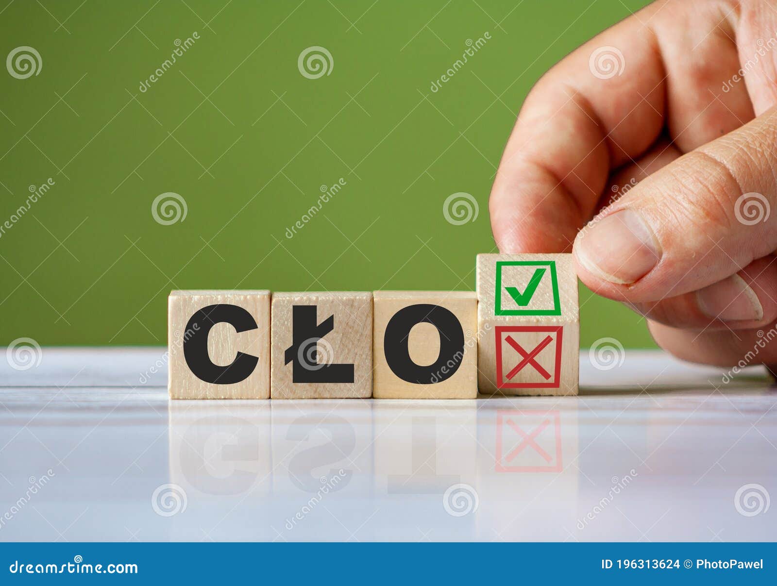 hand turn wooden block with red reject x and green confirm tick as change concept of polish word cÃâo, english duty. word cÃÂo