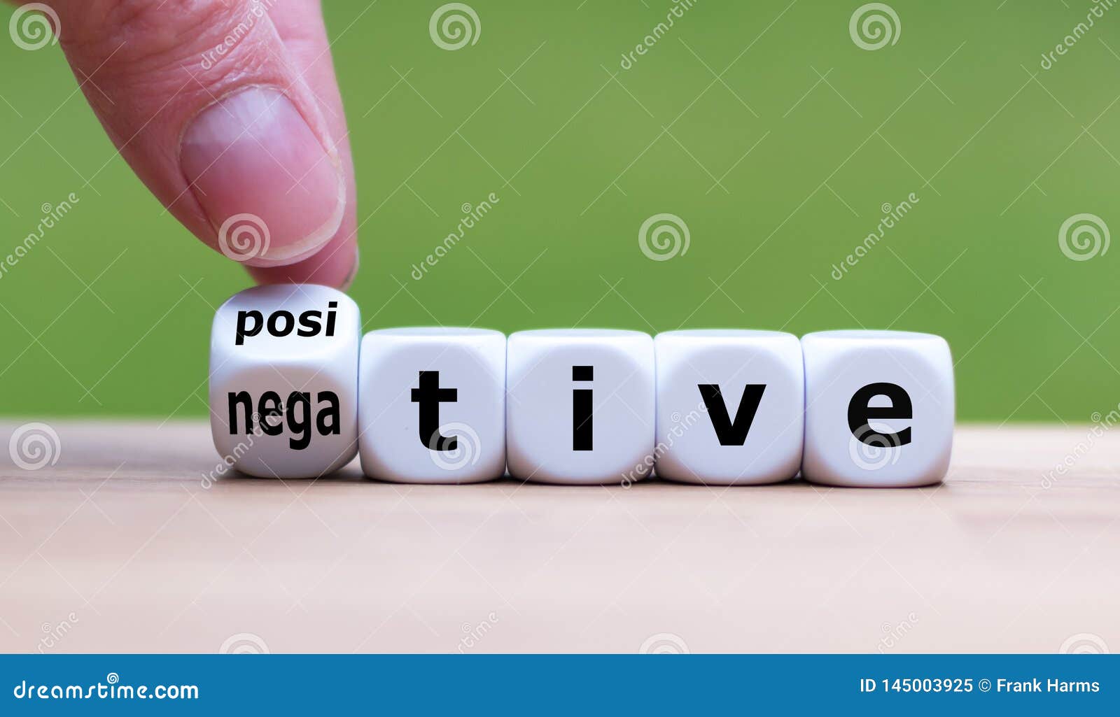 hand turns a dice and changes the expression `negative` to `positive`.