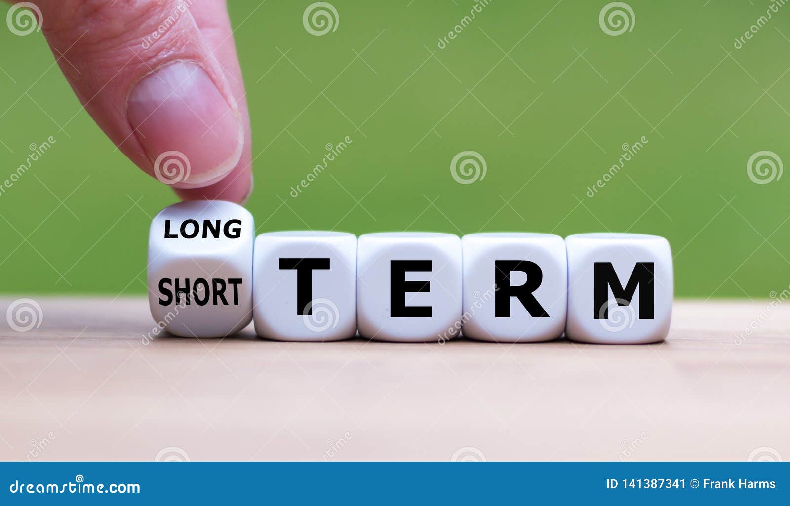 hand turns a dice and changes the expression `short term ` to `long term ` or vice versa.