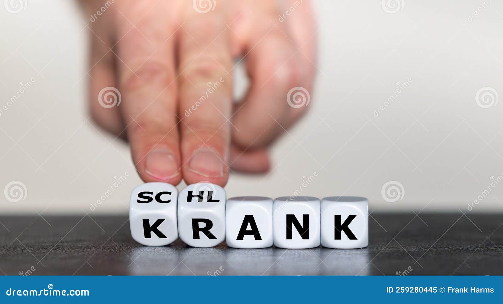 hand turns dice and changes the german word `krank` sick to `schlank` slim.