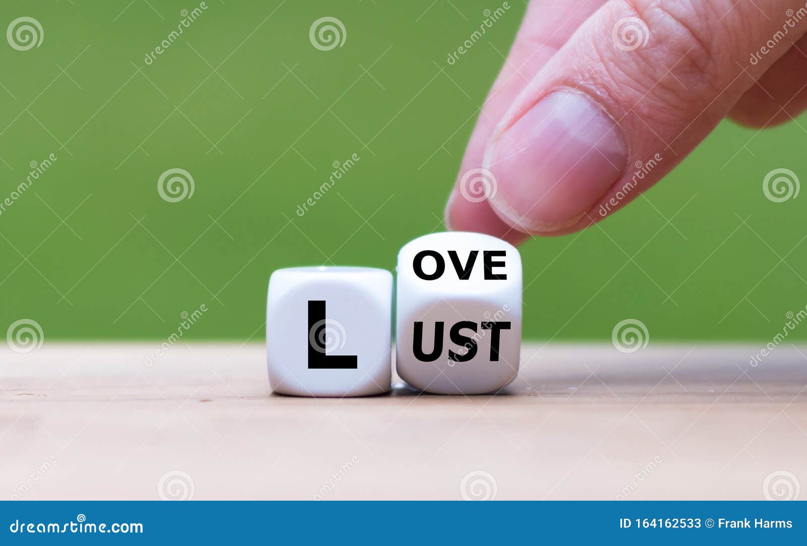 hand turns a dice and changes the word `lust` to `love`, or vice versa.
