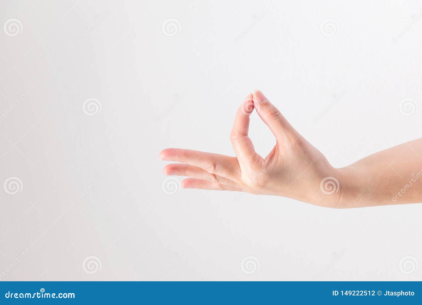 hand supine and touching tip of thumb and forefinger together on white background; posturing like holding very small, thin and