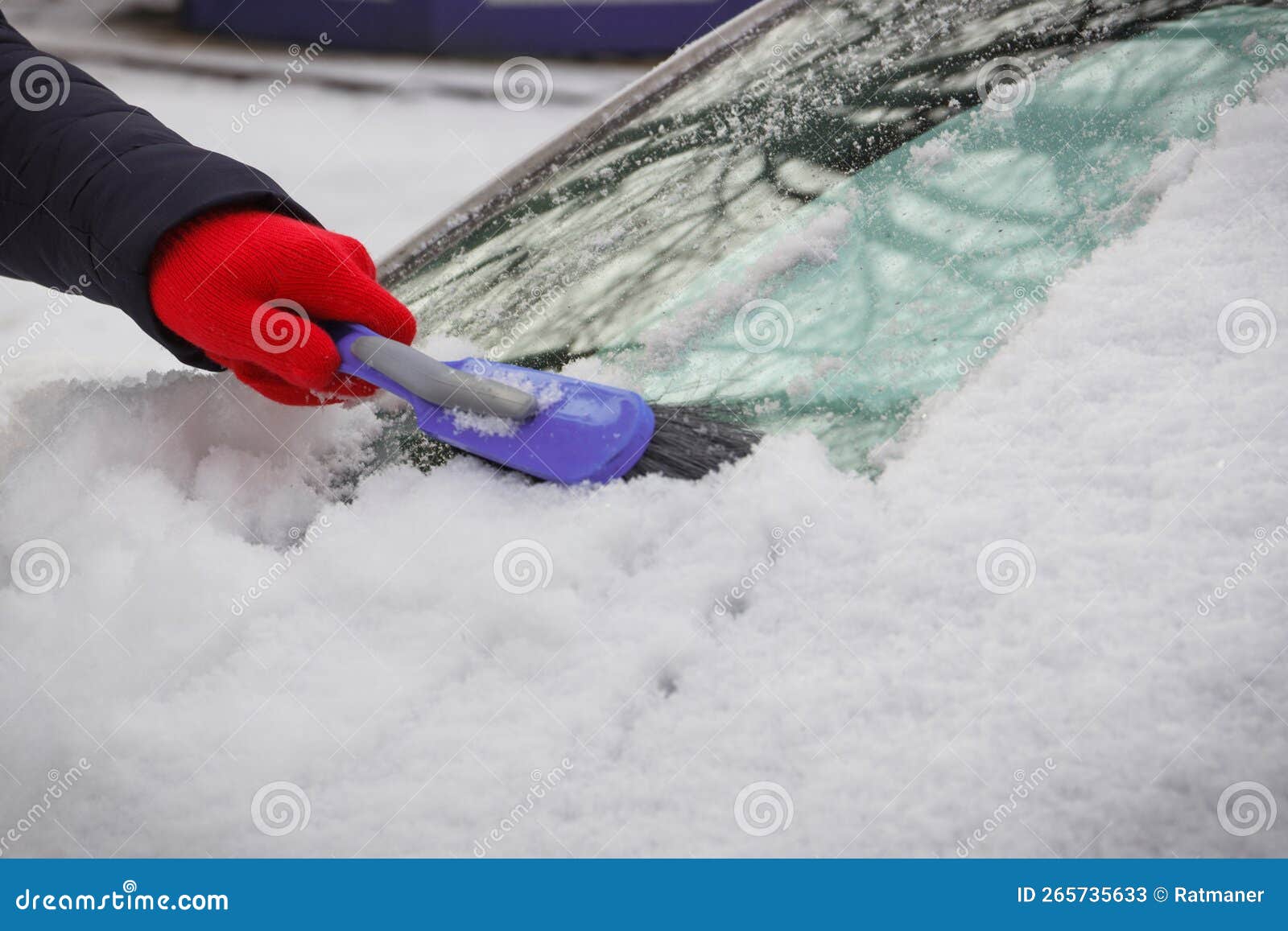Hand Using Brush and Remove Snow from Car and Windscreen. Problems in
