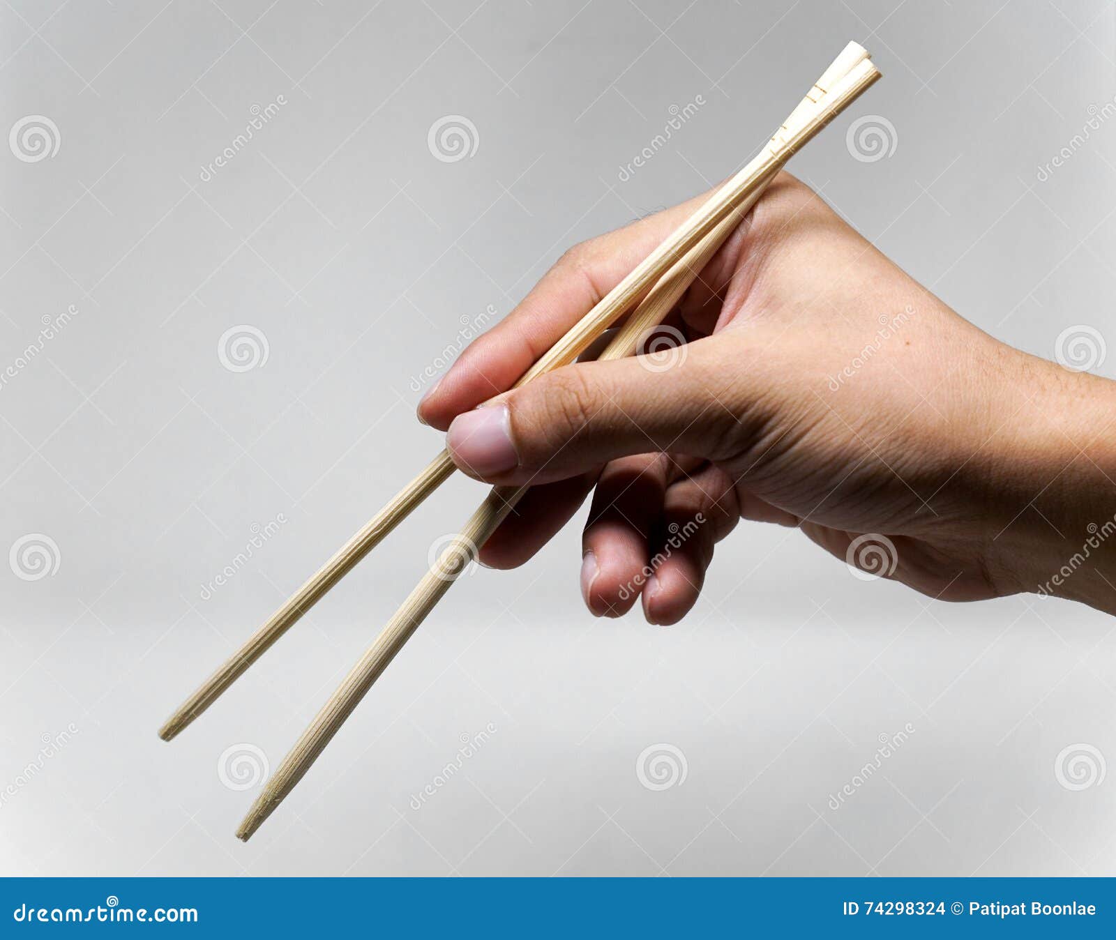 Hand using chopsticks stock photo. Image of open, gesture 74298324