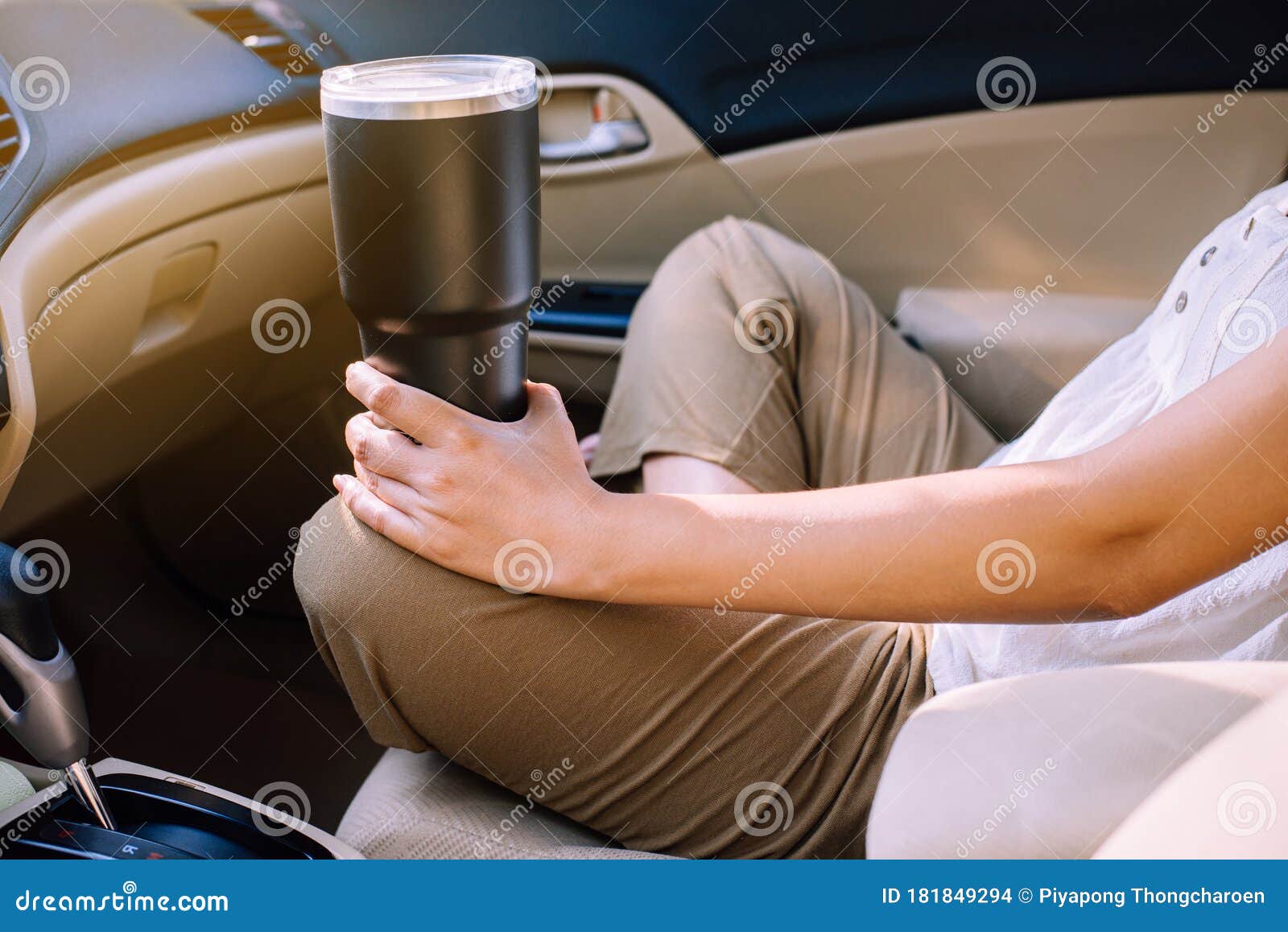 hand woman holding reusable drink a cup in car,environmental friendly,healthy green,zero waste,conscious lifestyle concept