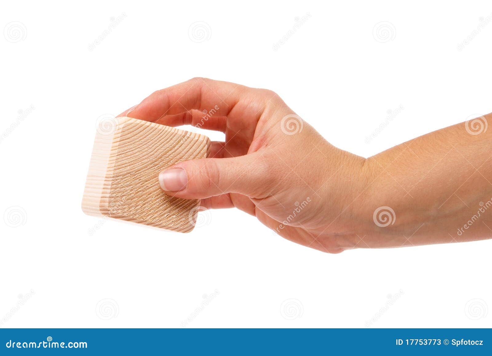 hand with wooden block