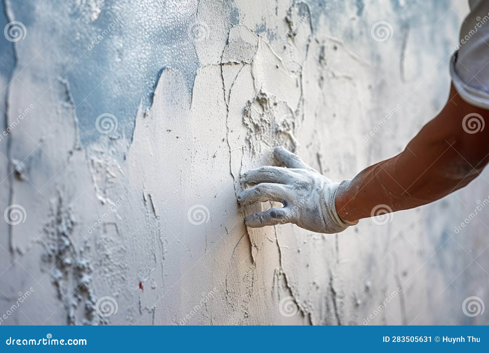 Hand of Worker Plastering Cement at the Wall for Building House Stock