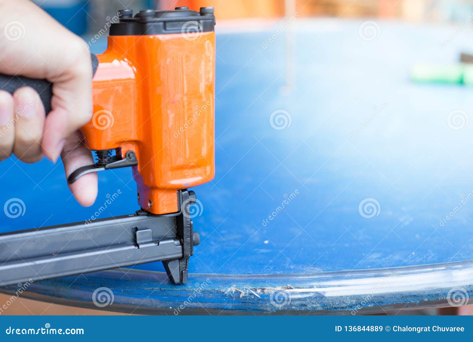 Hand of a Worker is Using a Nail Gun Stock Image Image of casual