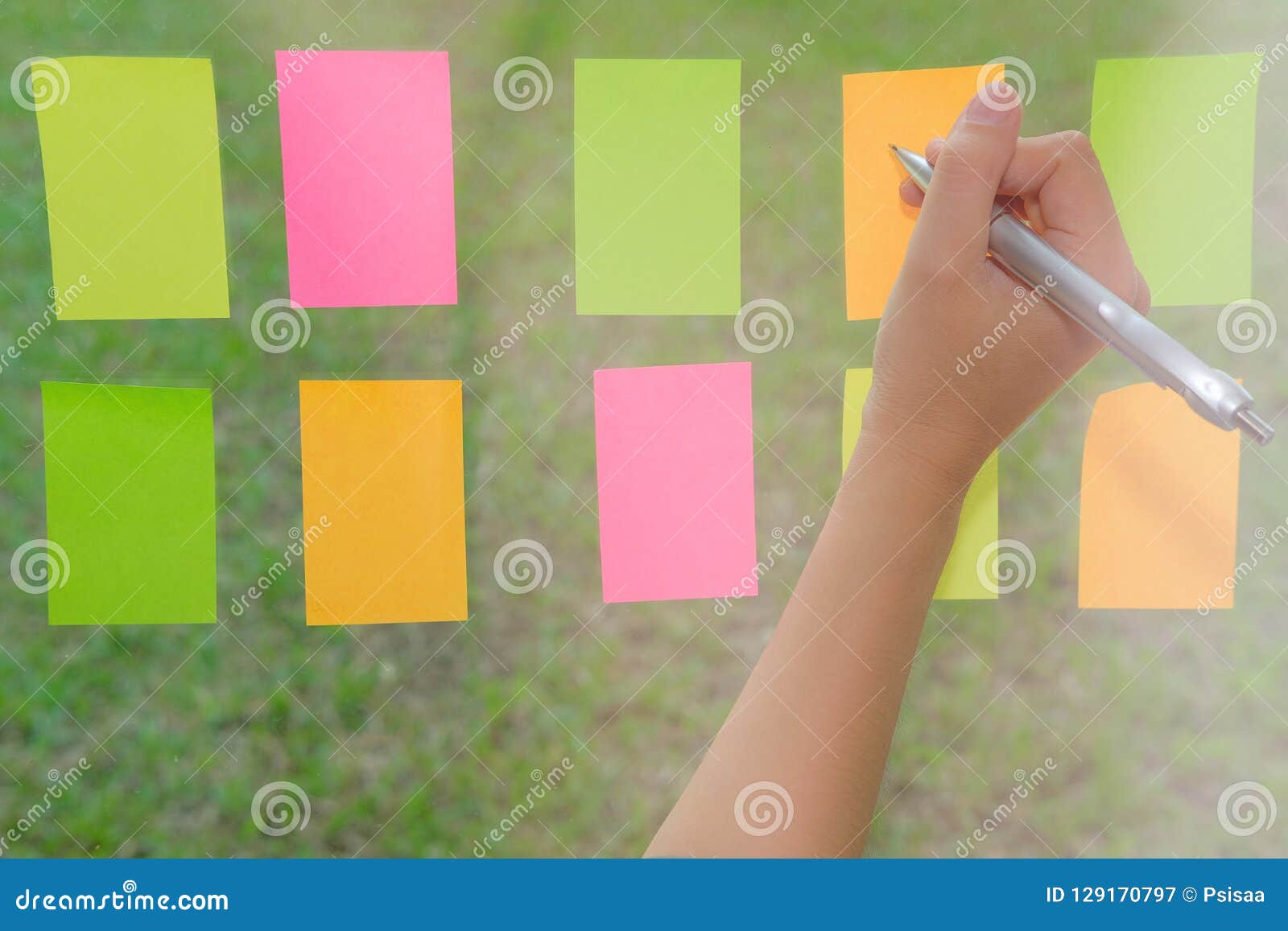 Hand Write on Adhesive Notes on Glass Wall. Sticky Note Paper Re Stock