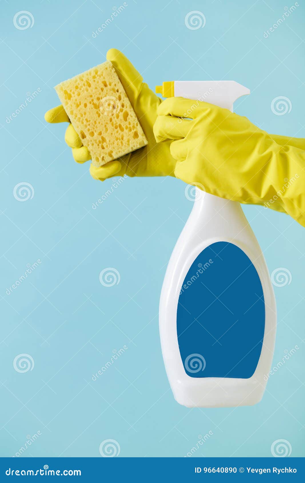 Hand In Yellow Glove Holds Spray Bottle Of Liquid Detergent And Sponge