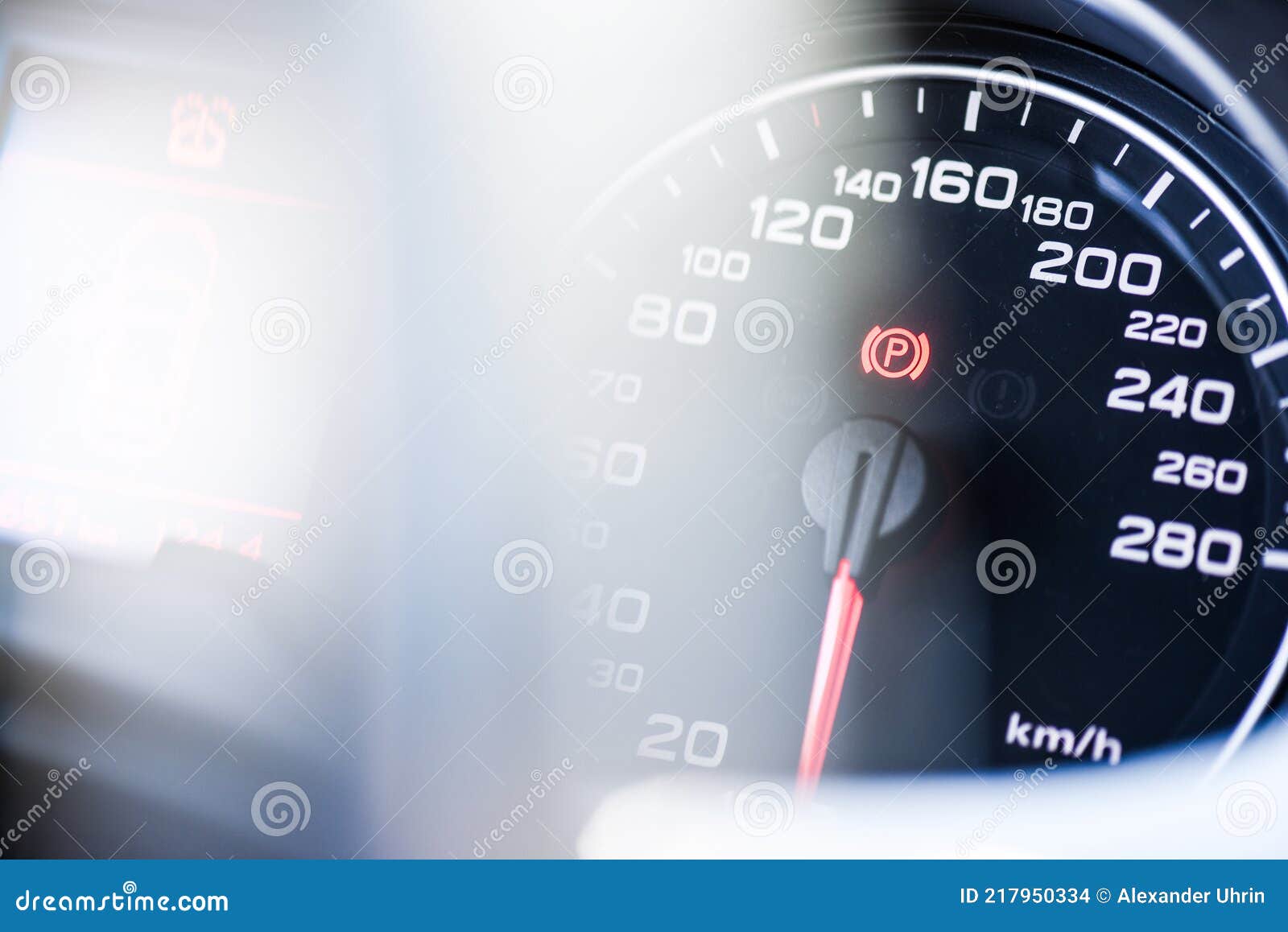 Handbrake Icon on the Dashboard. Modern Light Car Mileage. Stock Photo