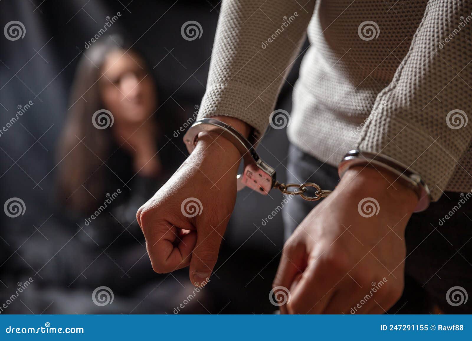 handcuffed man with locked hand in front. law for felony, arrested and cuffed for illegal act