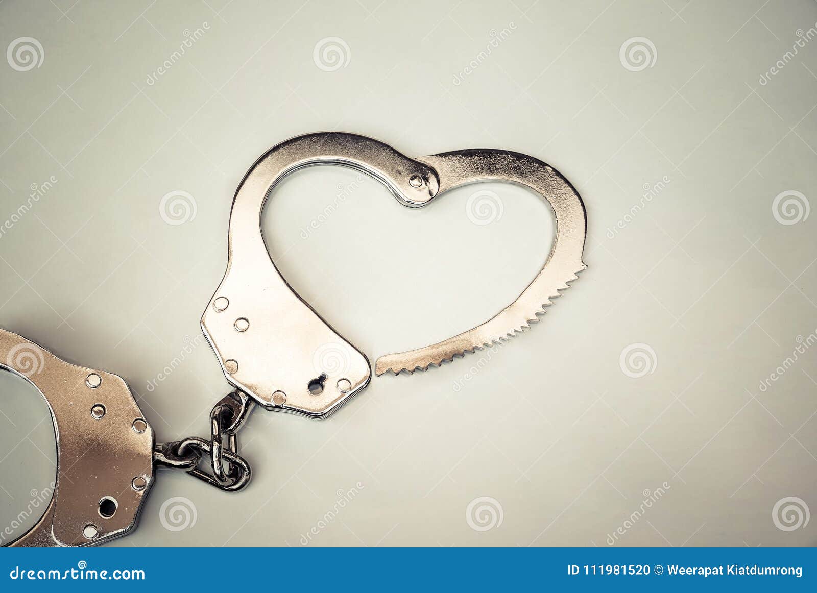Handcuffs in a love heart stock photo. Image of love 111981520