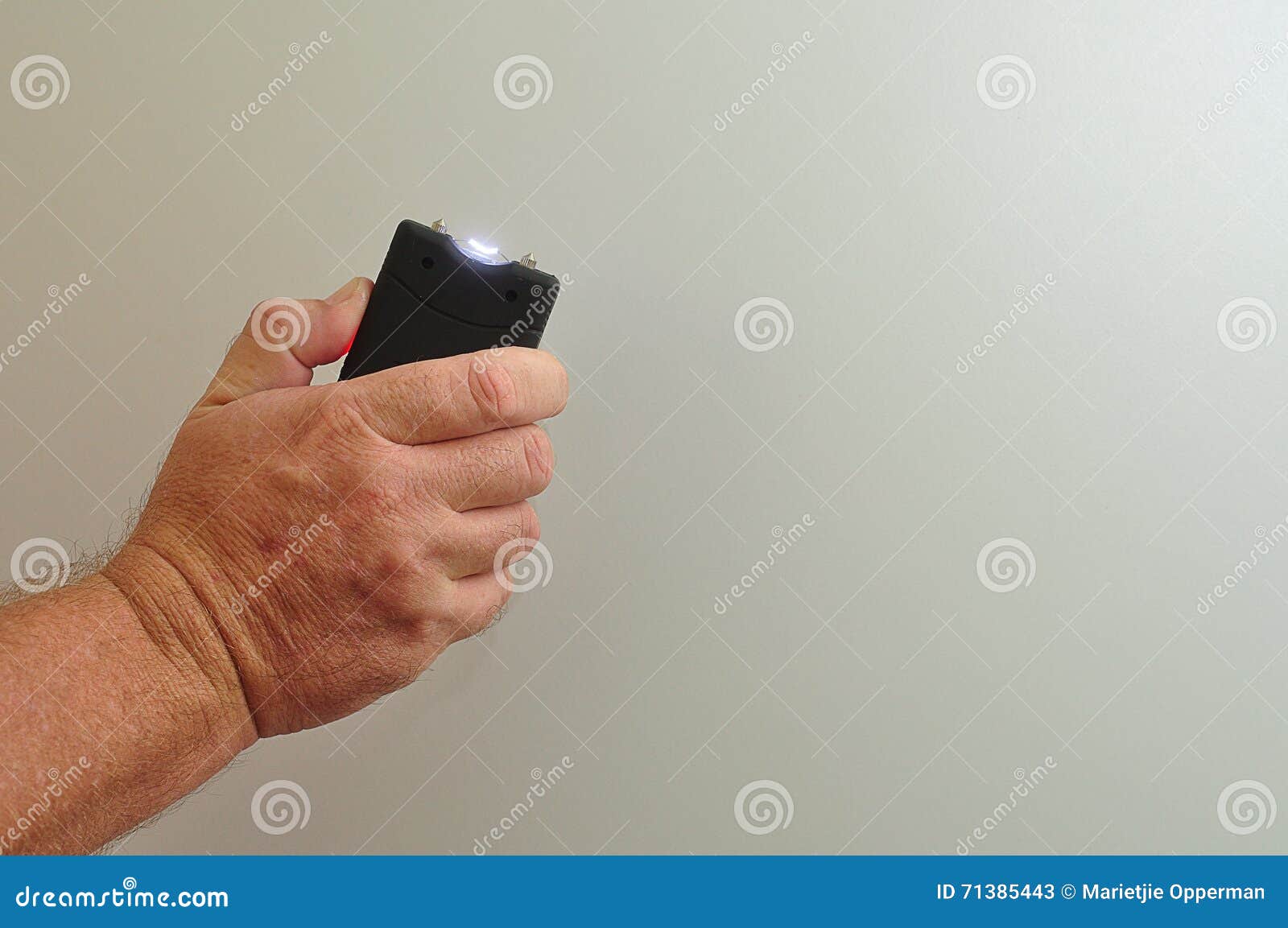 A handheld taser stock image. Image of white, protection 71385443