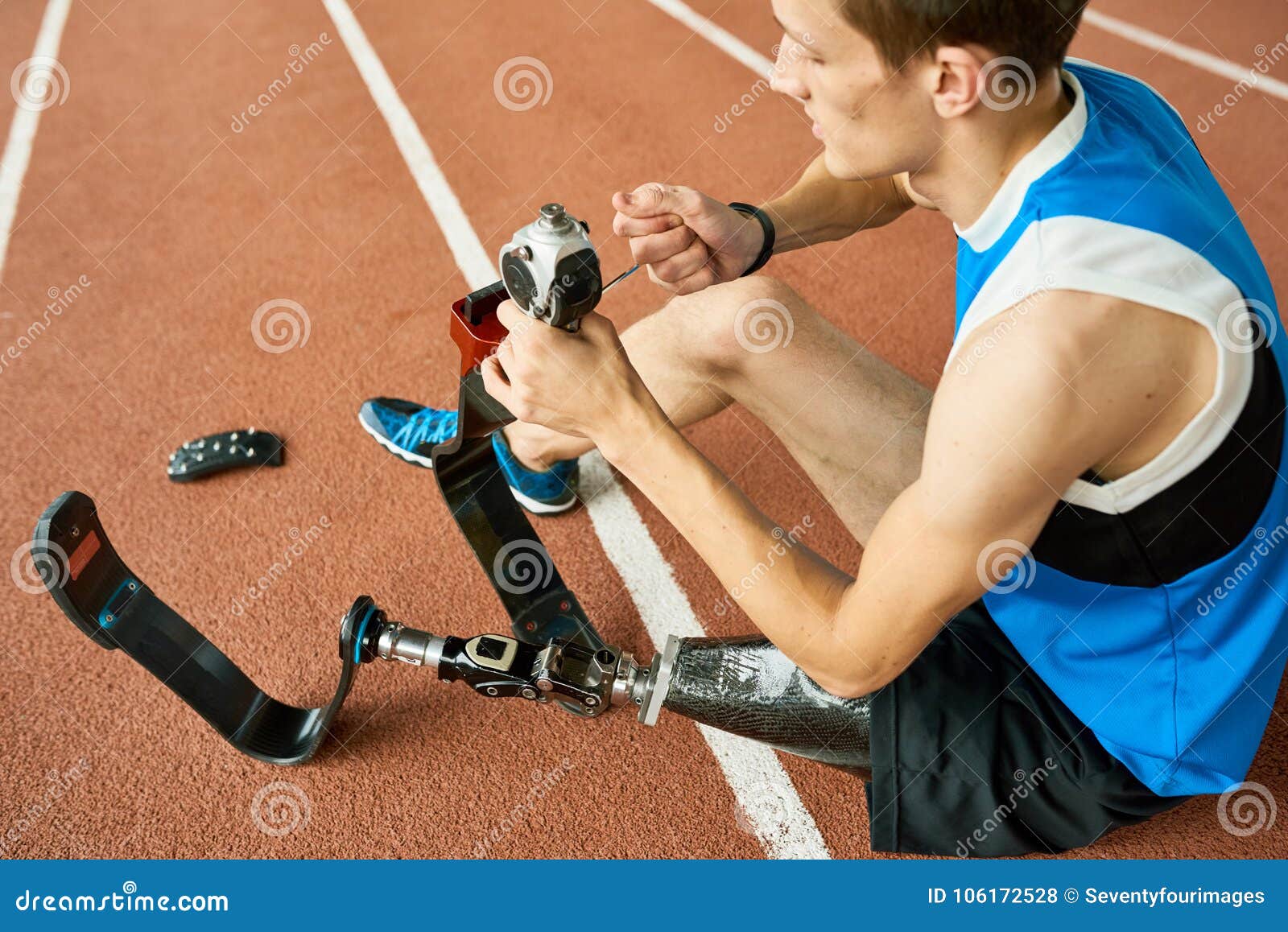 handicapped sportsman repairing prosthetic leg