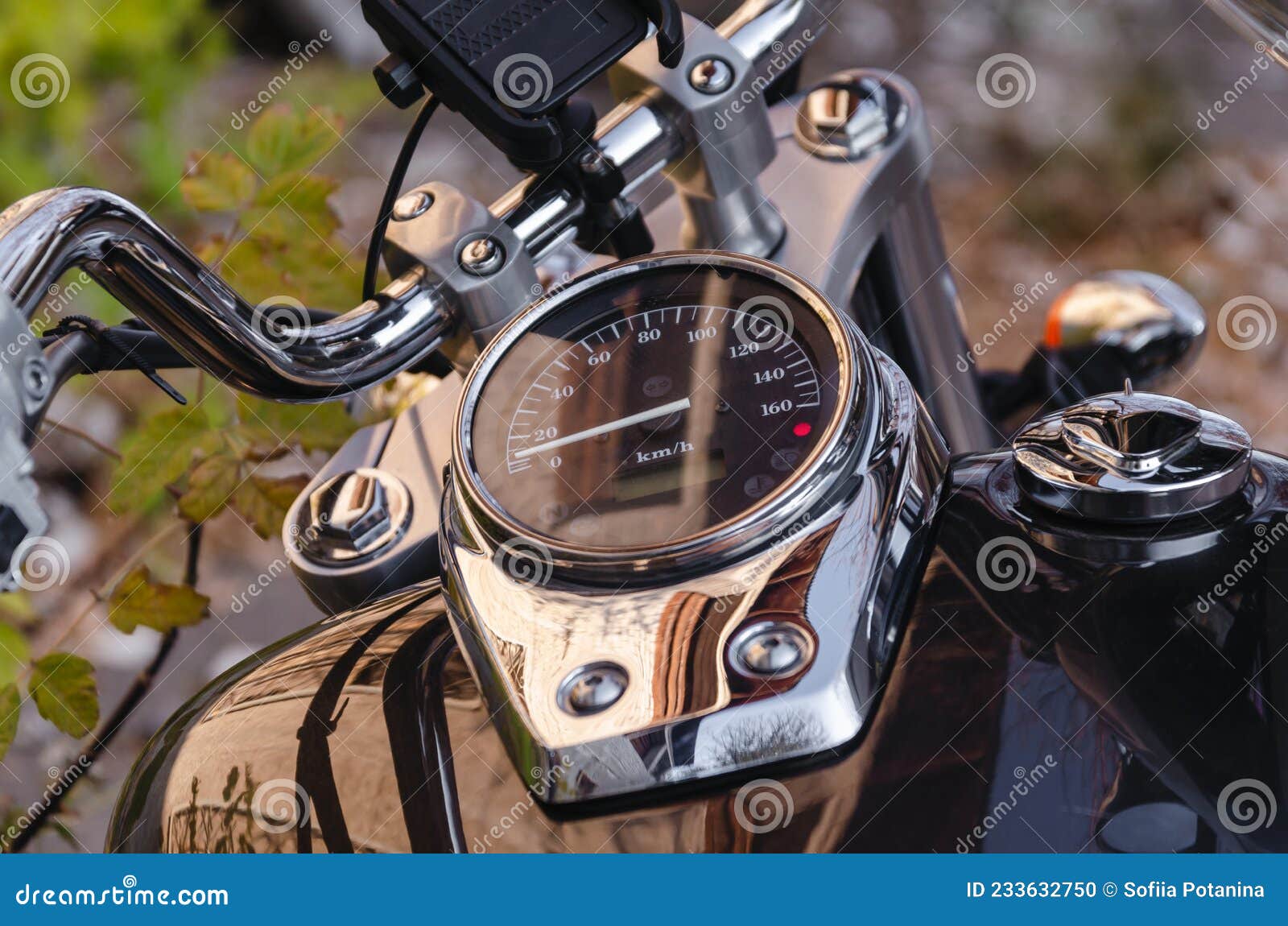 Handlebar and Speedometer of Classic Chopper Motorcycle Close Up Stock