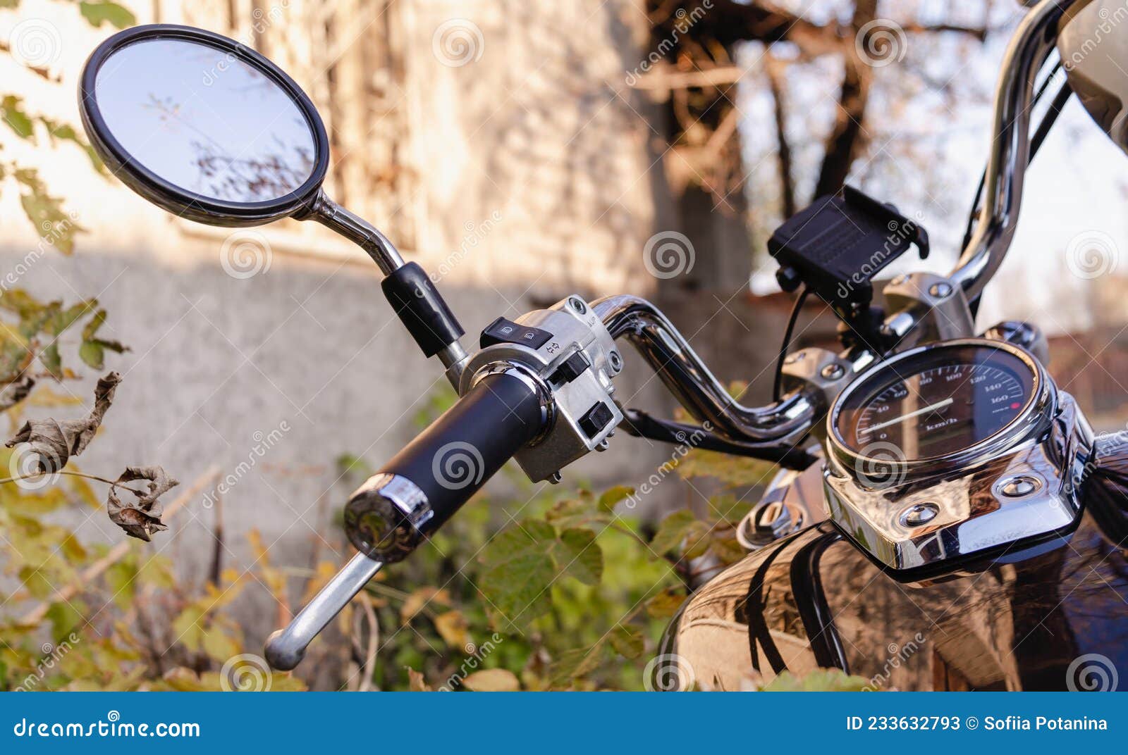 Handlebar and Speedometer of Classic Chopper Motorcycle Close Up Stock