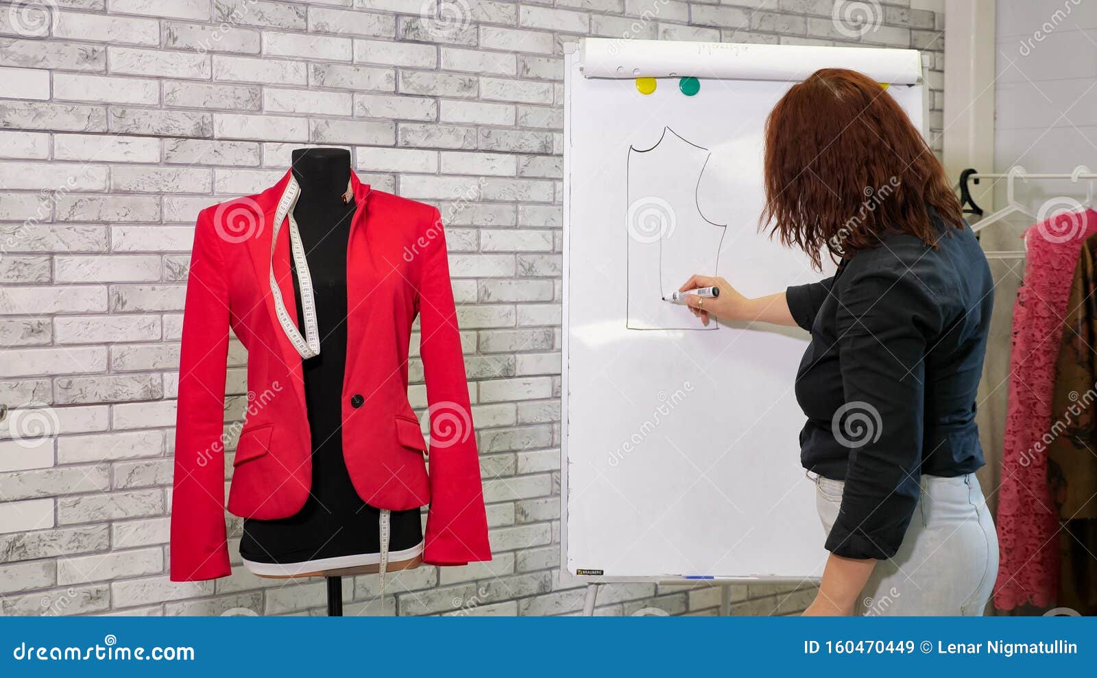 Dressmaker Draws a Pattern of Jacket on White Board in Sewing