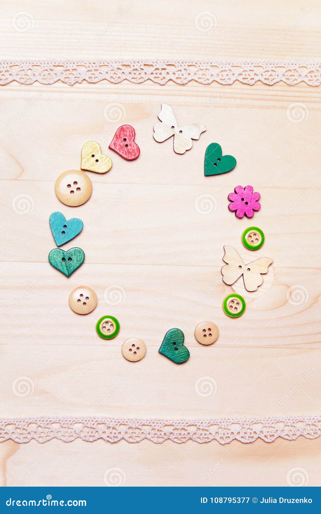 Lots of colorful buttons for clothes on wooden background