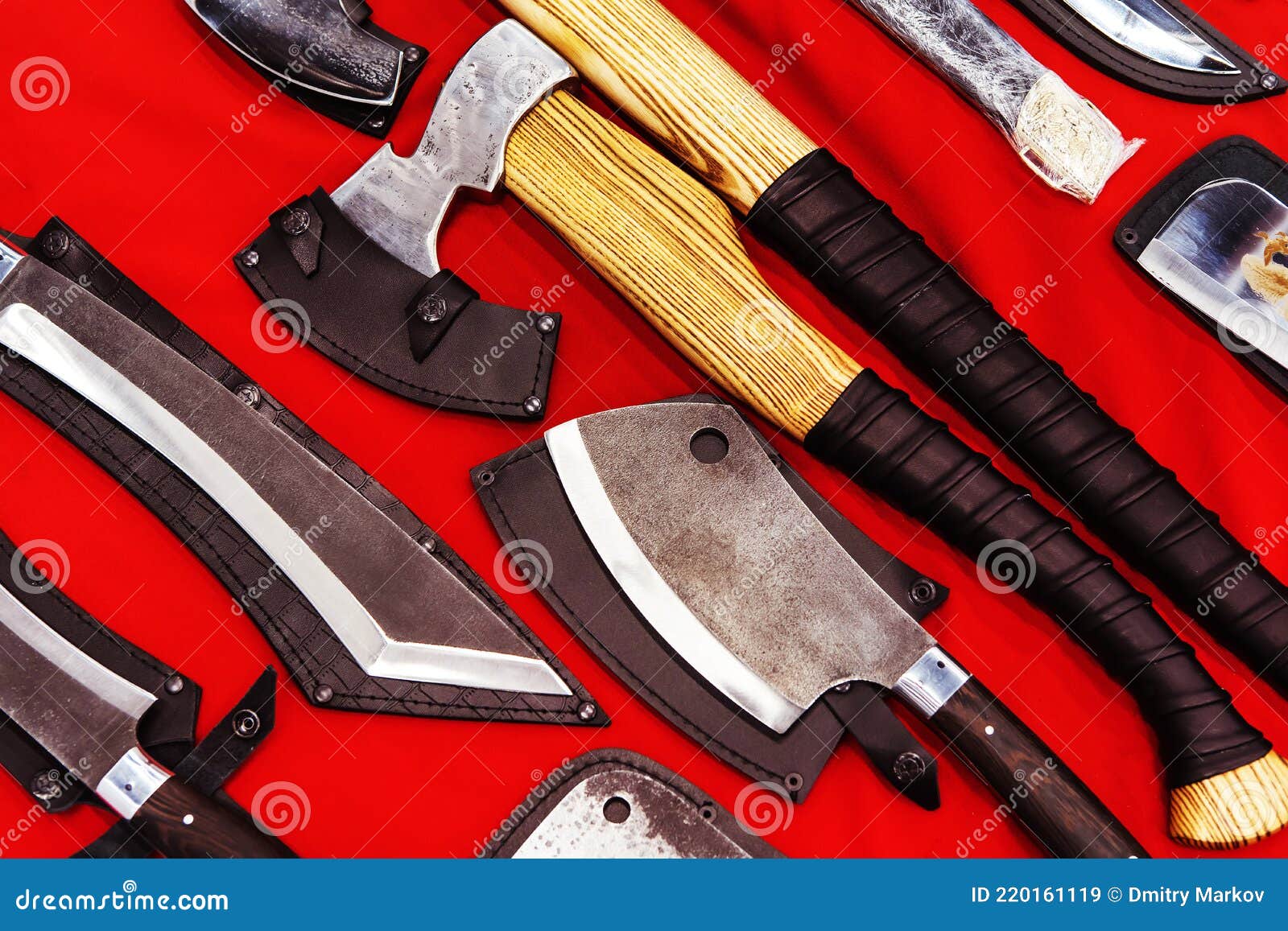 handmade decorative axes in retro style on a red background.