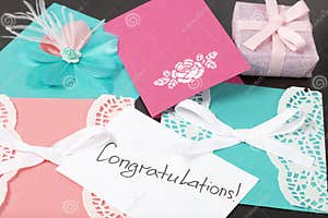 Handmade Greeting Cards Near Gift In Wrapping Paper Tied With A 
