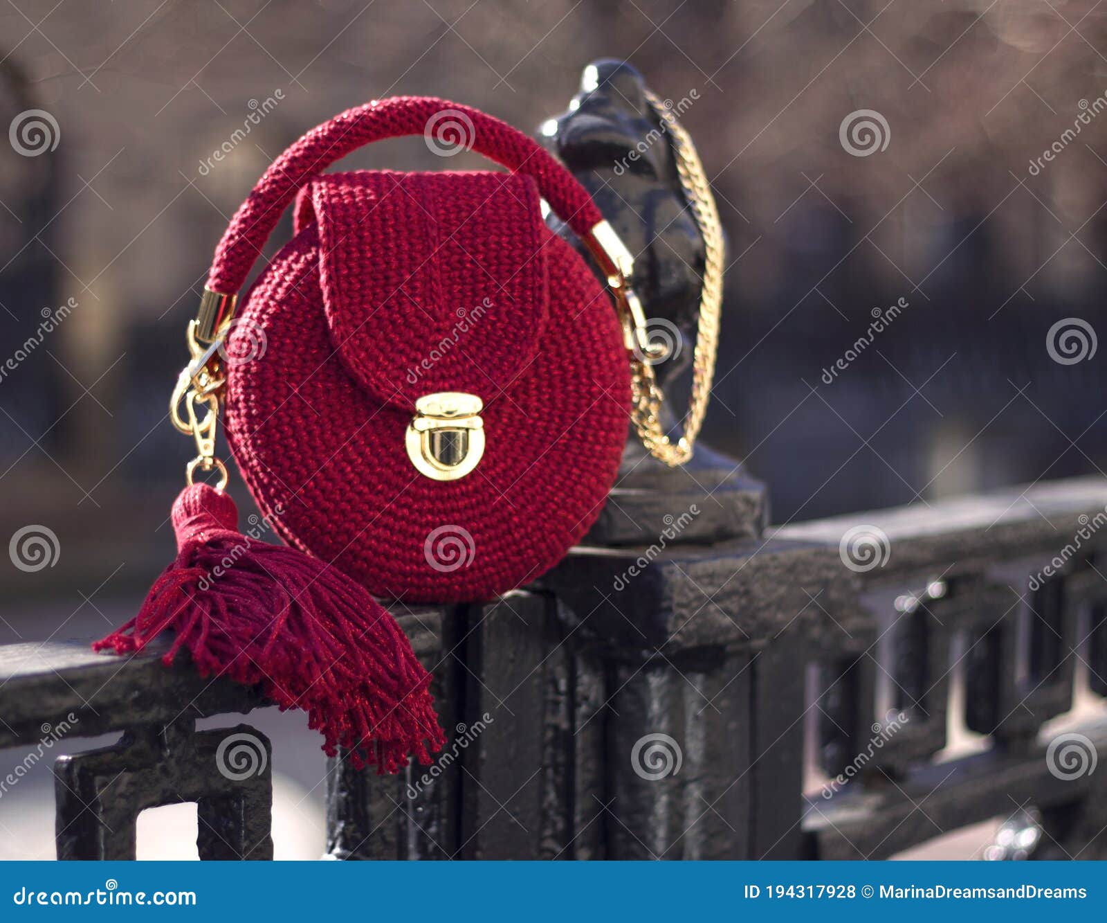handmade red textile knitted bag with shiny threads