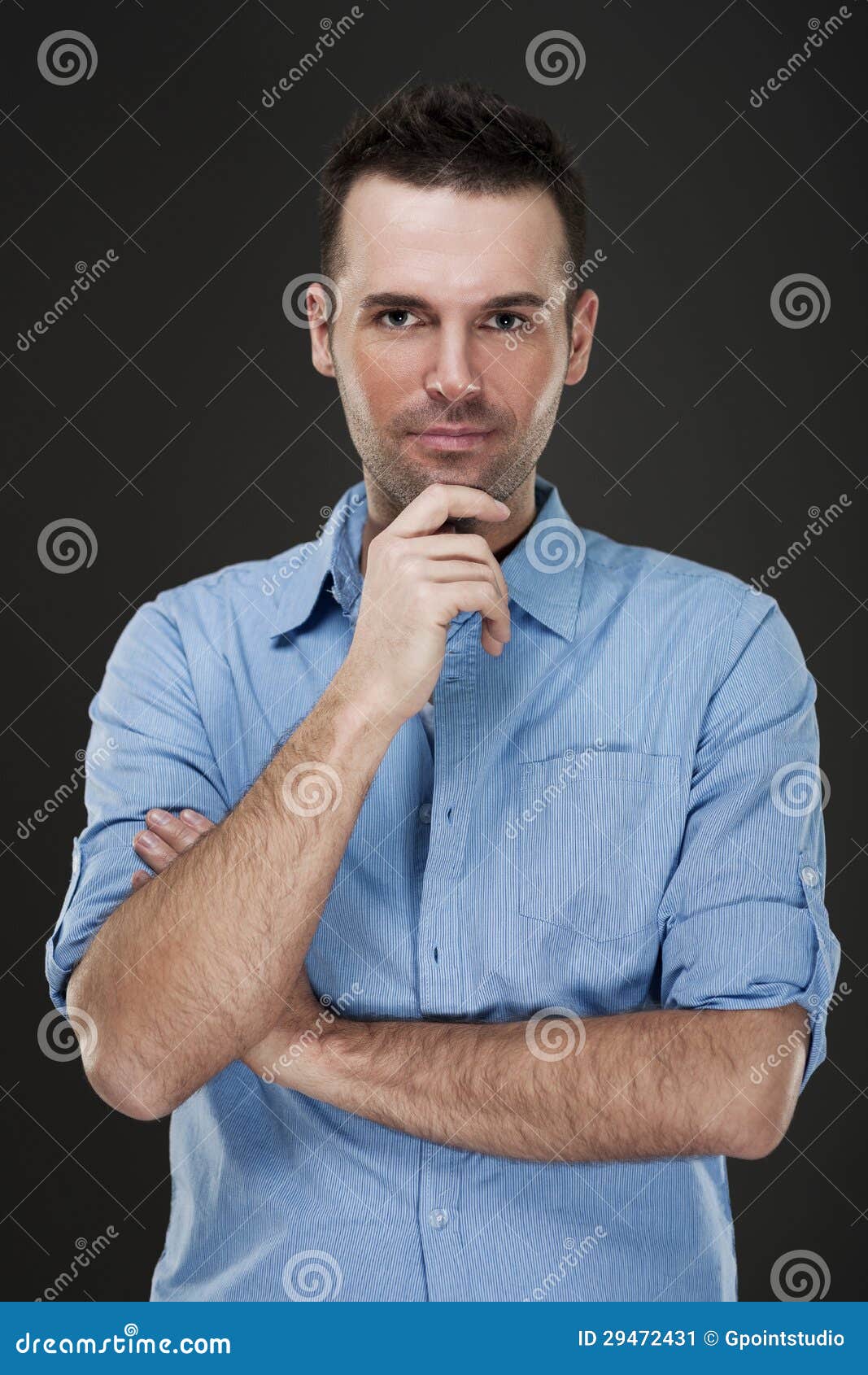 Handome man. Cheerful man smiling with arms crossed