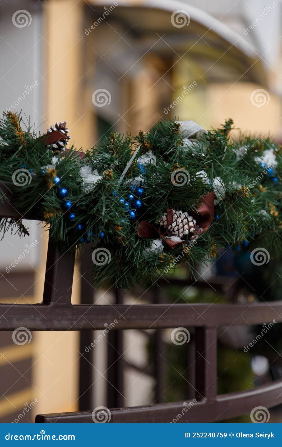 Handrail Decorated with Green Tinsel Garland, Blue Beads and Fir Cones ...