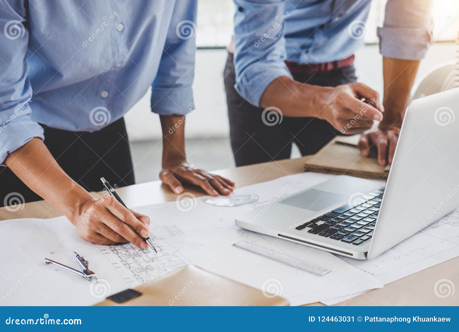 hands of architect or engineer working on blueprint meeting for