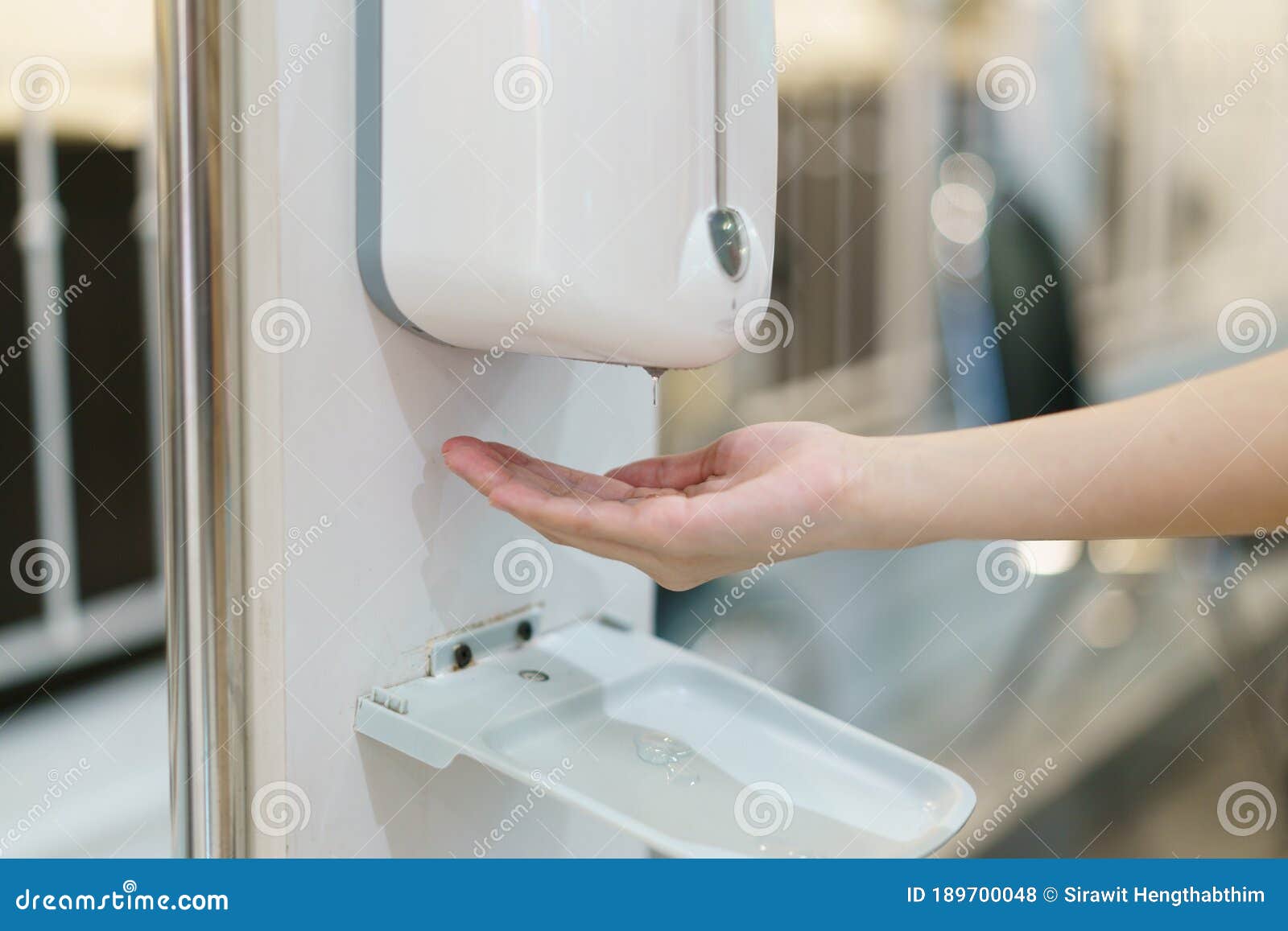Hands with Automatic Sanitizer Liquid Spray Machine, Touchless Dispenser Stock Photo Image of