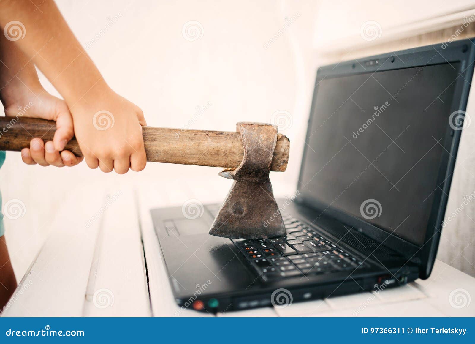 hands with an ax and a laptop